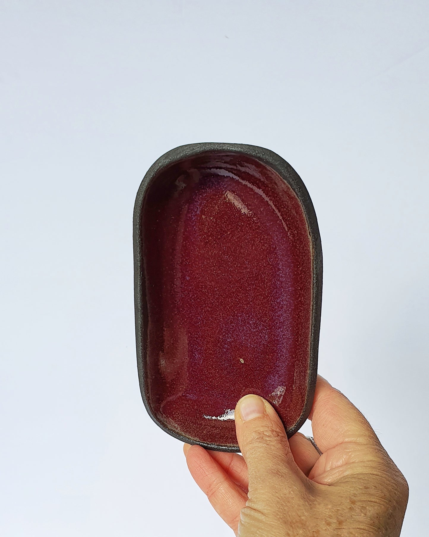 Svuotatasche MINI in gres nero di diversi colori di 12,5 x 7,5cm.
