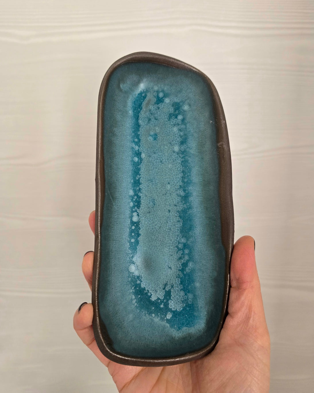 Piattini / Svuotatasche in gres nero di diversi colori di 18 x 7cm.